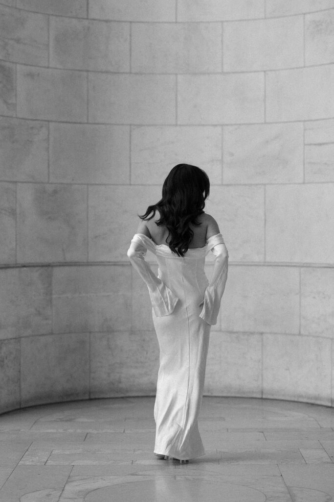 woman posing while wearing modern and sleek engagement dress